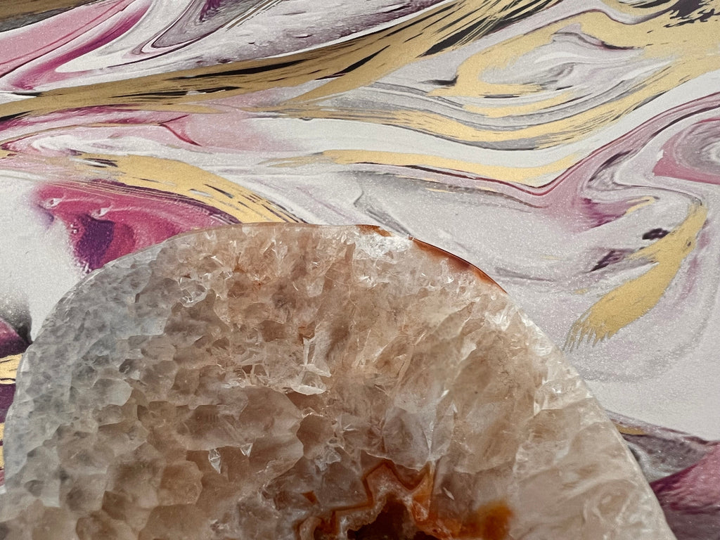 close up of agate crystal heart carving showing small chip